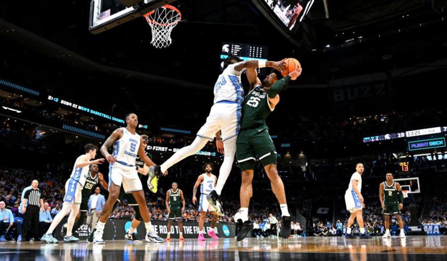 CHARLOTTE, NORTH CAROLINA - MARCH 23: Jae'Lyn Withers #24 of the North Carolina Tar Heels defends Malik Hall #25 of the Michigan State Spartans during the first half of the second round of the NCAA Men's Basketball Tournament at Spectrum Center on March 23, 2024 in Charlotte, North Carolina. (Photo by Grant Halverson/NCAA Photos via Getty Images)