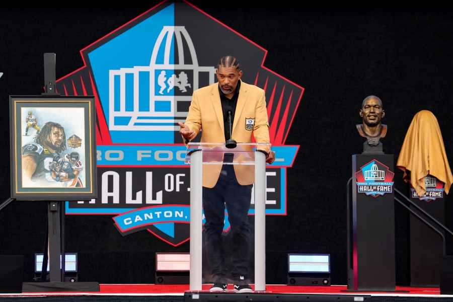 Julius Peppers addresses the crowd at the 2024 Pro Football Hall of Fame Enshrinement Ceremony on August 3, 2024, at the Tom Benson Hall of Fame Stadium in Canton, OH. 