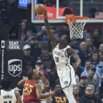 Brooklyn Nets forward Dorian Finney-Smith (28) blocks a shot by Cleveland Cavaliers forward Isaac Okoro (35)