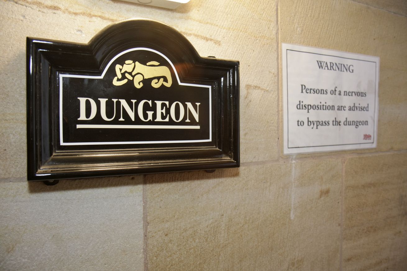 The dungeon sign inside Bamburgh Castle.